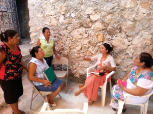 Minerva (seated left), Francelia and other women of the church preoccupied for the education of the children